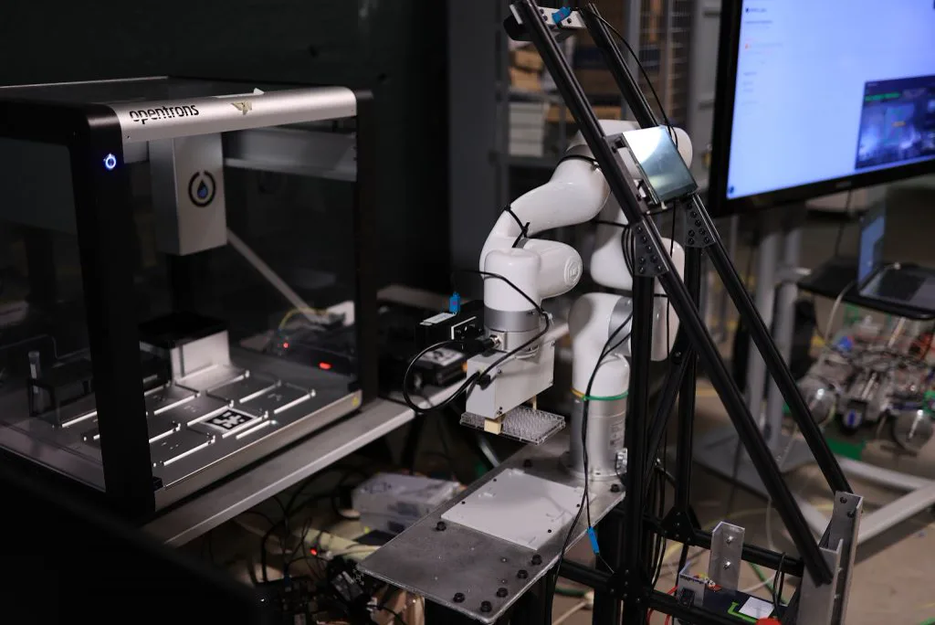 APEX Lab team with a mobile manipulation robot in a laboratory