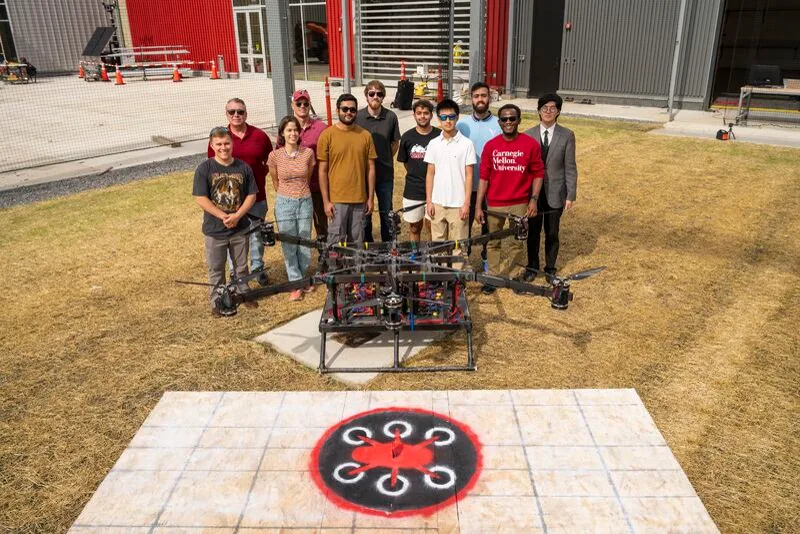 TartanAirRescue team gathered around a large eight-foot drone